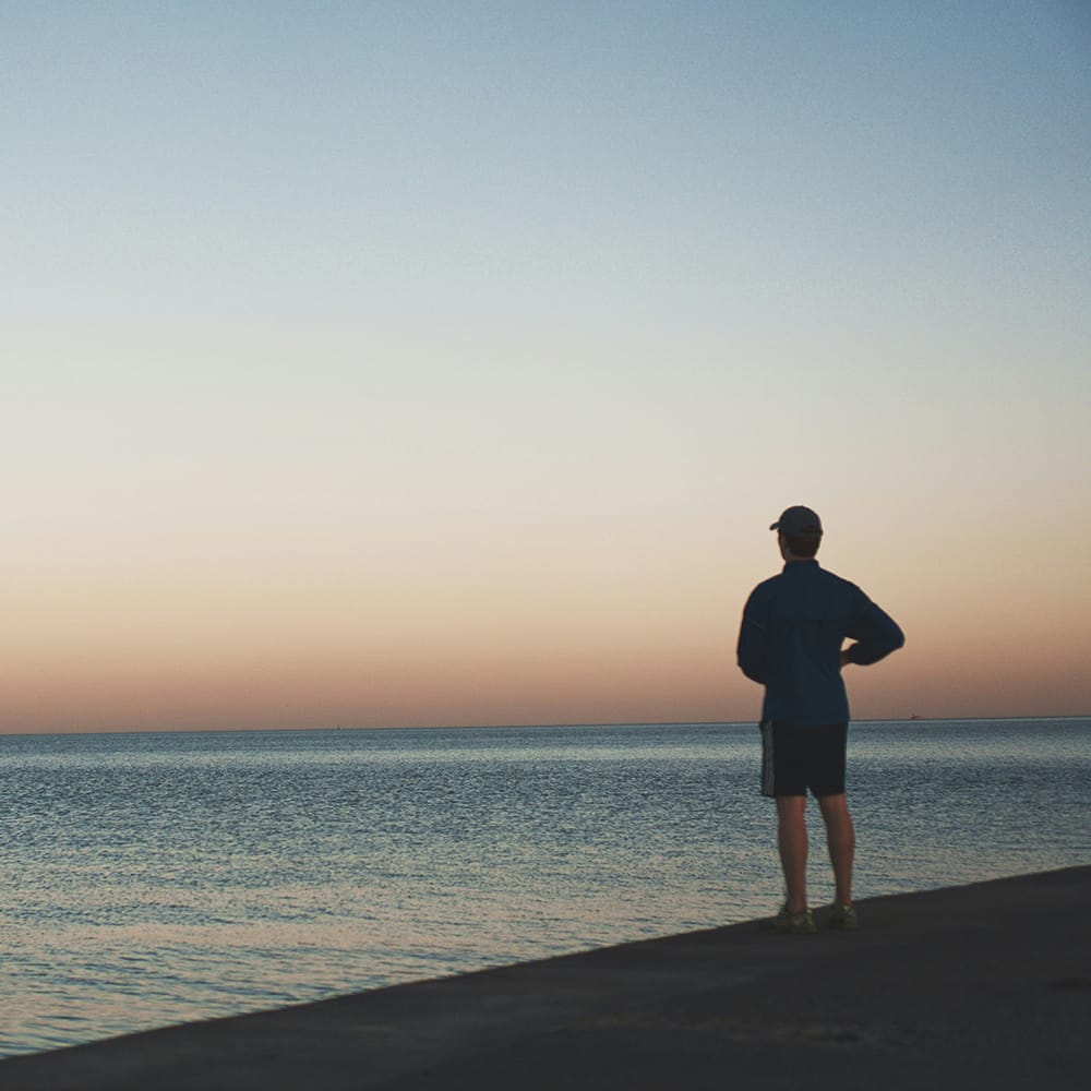 robert-v-ruggiero-w6VGdenFu3c-unsplash Man watching the sunset